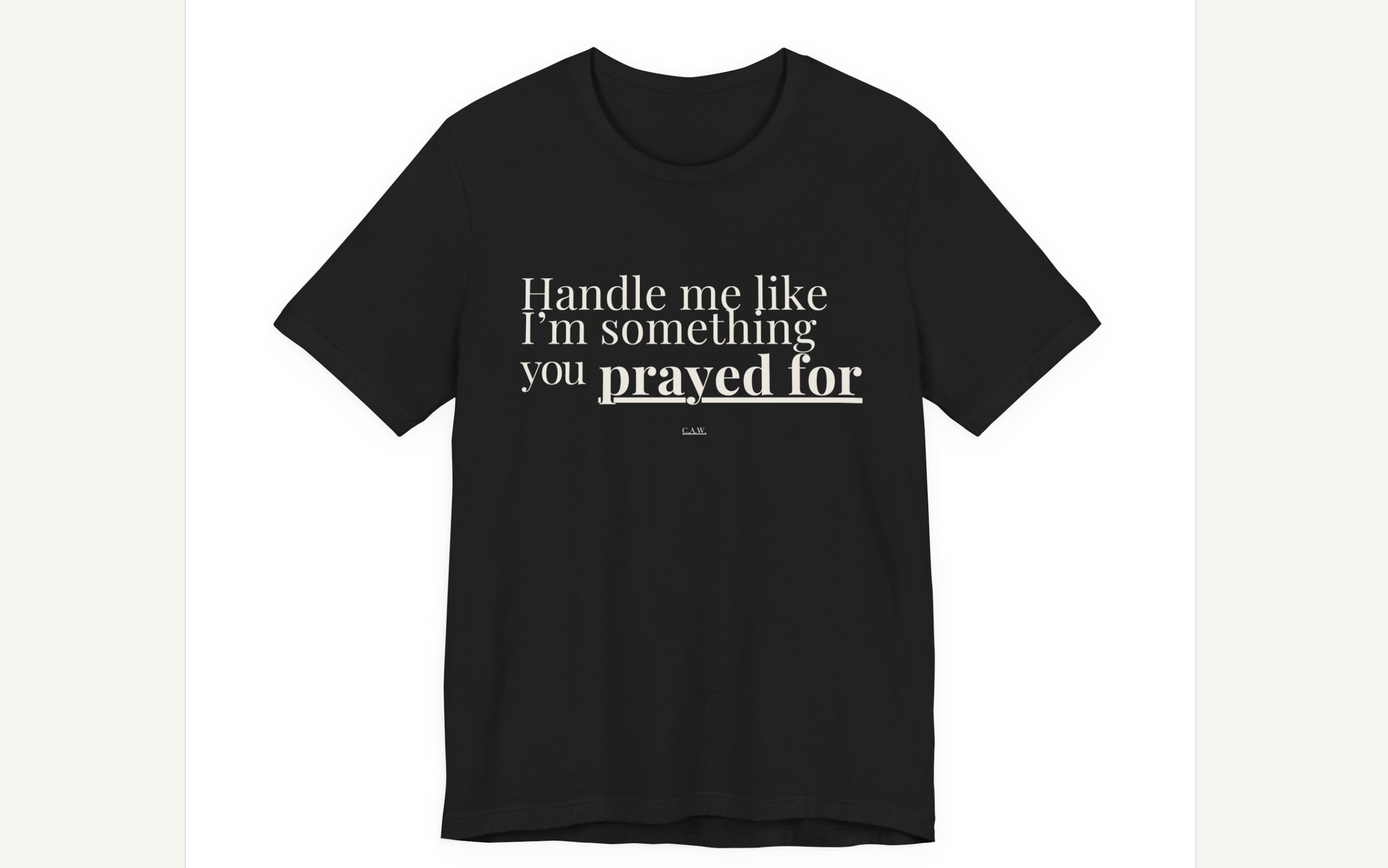 Black t-shirt with white text on a website mockup