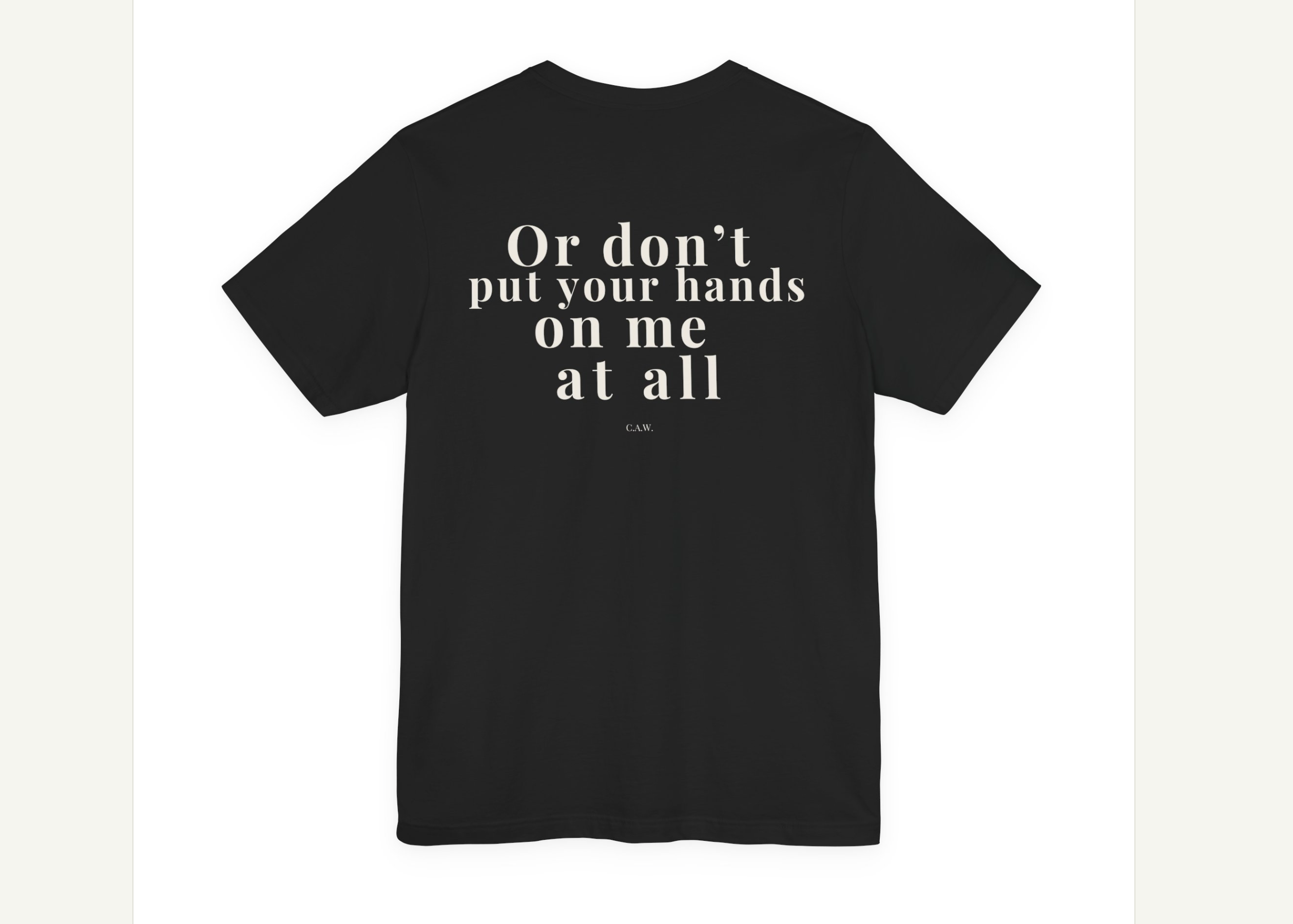 Black t-shirt with white text on a design software interface